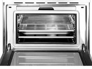 Компактный духовой шкаф с пароваркой Smeg SF4750VCBS фото 3 в Тюмени
