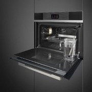 Компактный духовой шкаф с пароваркой Smeg SF4104WVCPN фото 2 в Тюмени