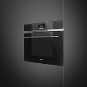 Компактный духовой шкаф с пароваркой Smeg SF4104VCN фото 2 в Тюмени